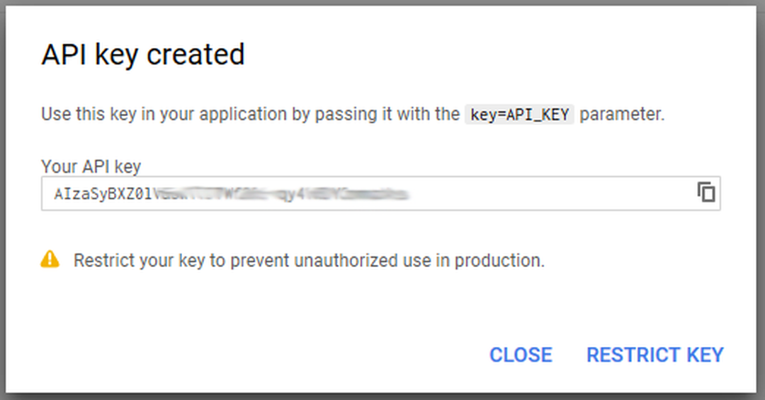 Az API key created ablak a részben kitakart új API-kulccsal, jobb alul a Restrict Key gomb